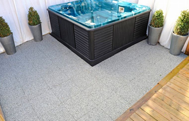 Resin bound porous surfaces for  patio and hot tub social settings